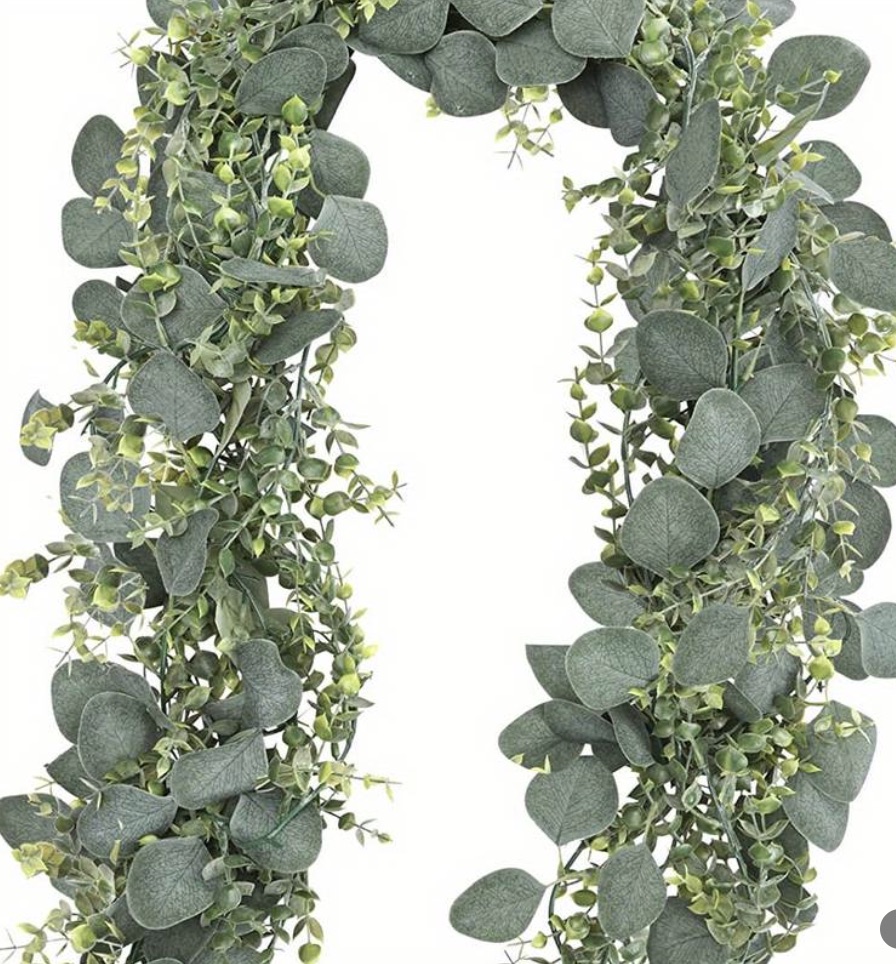 A long silk eucalyptus garland, its leaves running the full length of the strand.